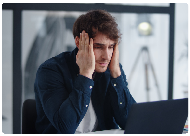 bookkeeping cleanup for small business owner stressed at desk